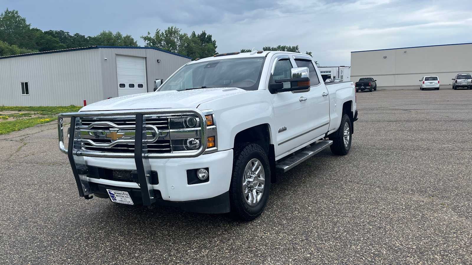 2016 Chevrolet Silverado 3500 HD High Country in Summit White — front three-quarter view