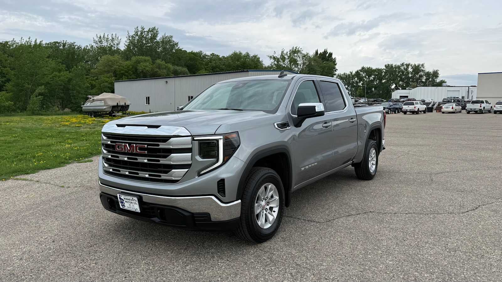 2024 GMC Sierra 1500 SLE in Sterling Metallic — front three-quarter view