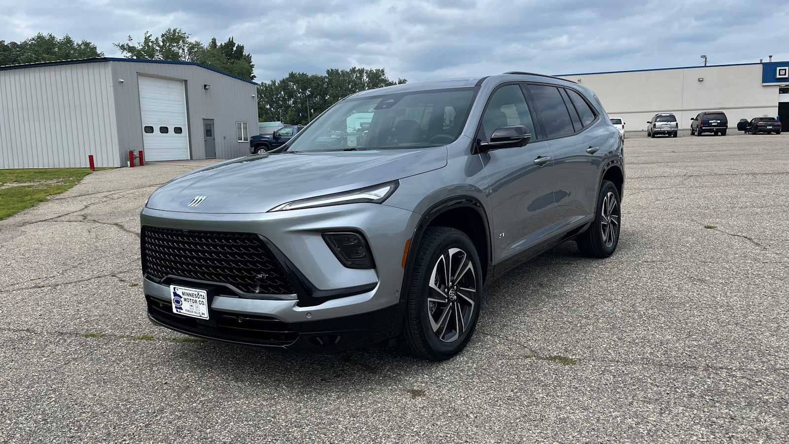 2026 Buick Enclave Sport Touring in Moonstone Gray Metallic — front three-quarter view
