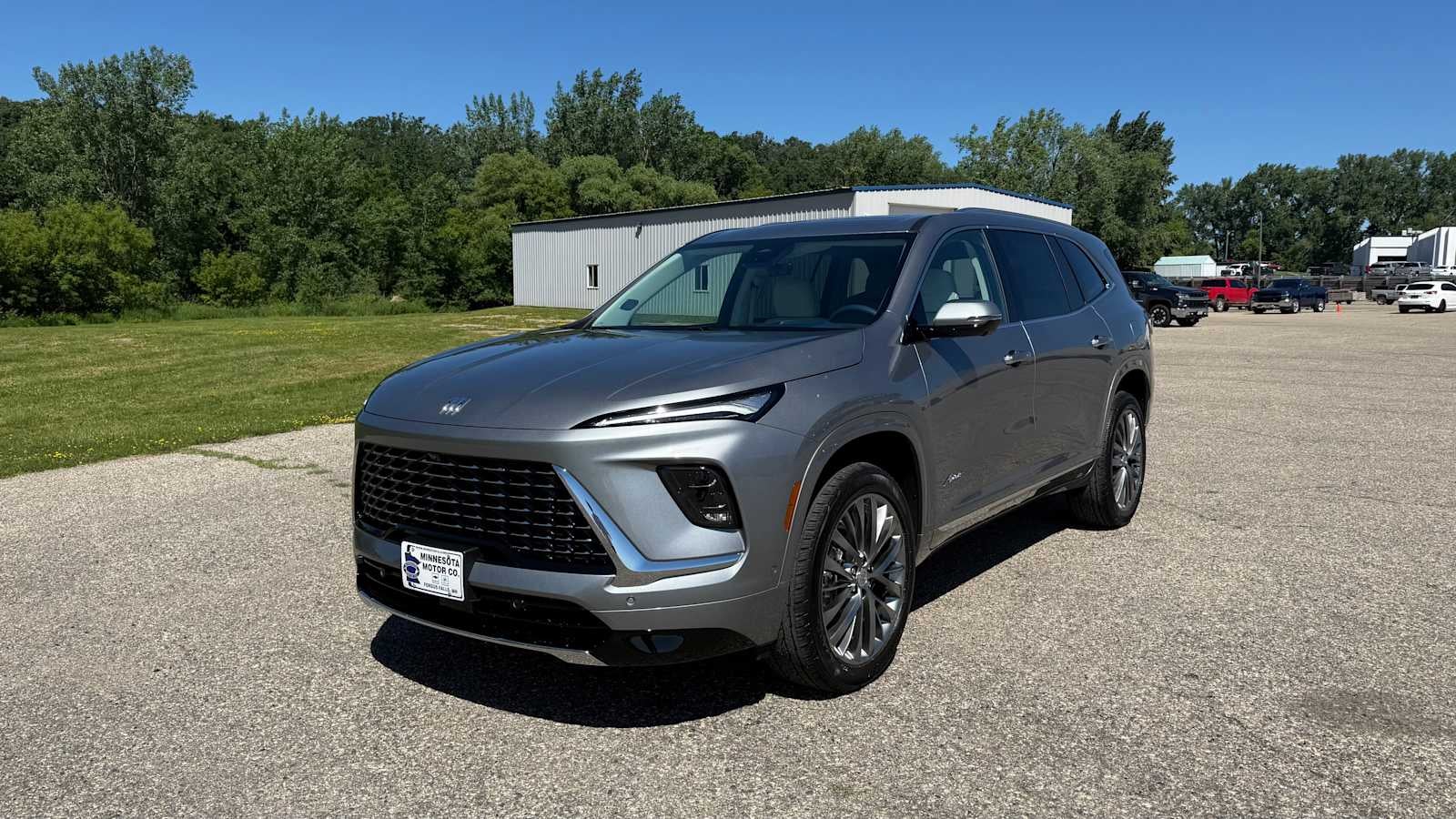 2026 Buick Enclave Avenir in Moonstone Gray Metallic — front three-quarter view