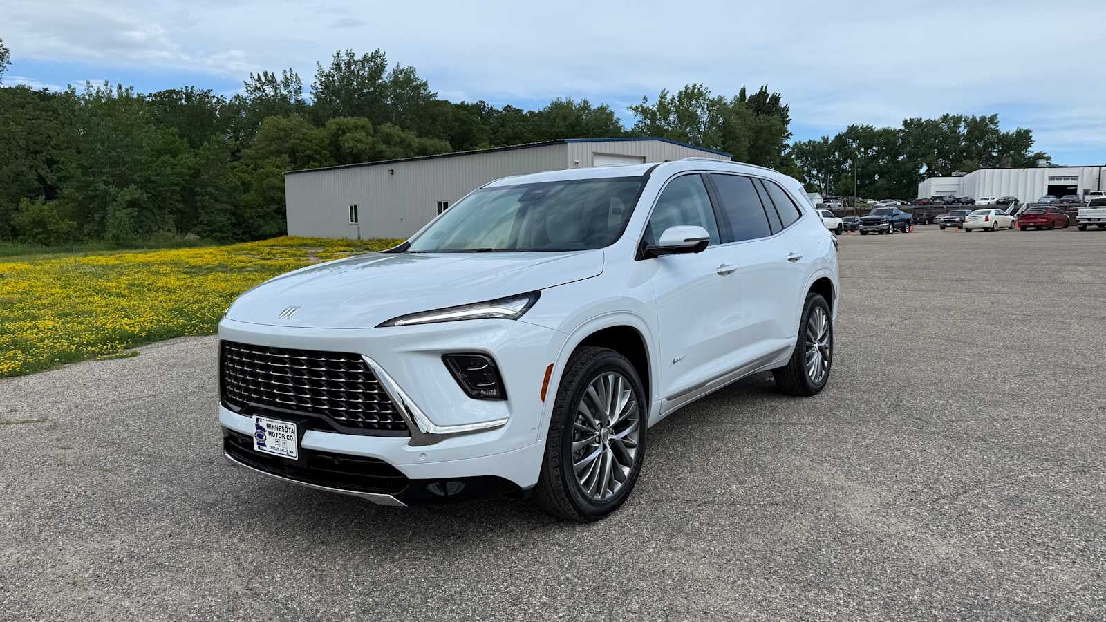 2026 Buick Enclave Avenir in Iridescent White Tricoat — front three-quarter view