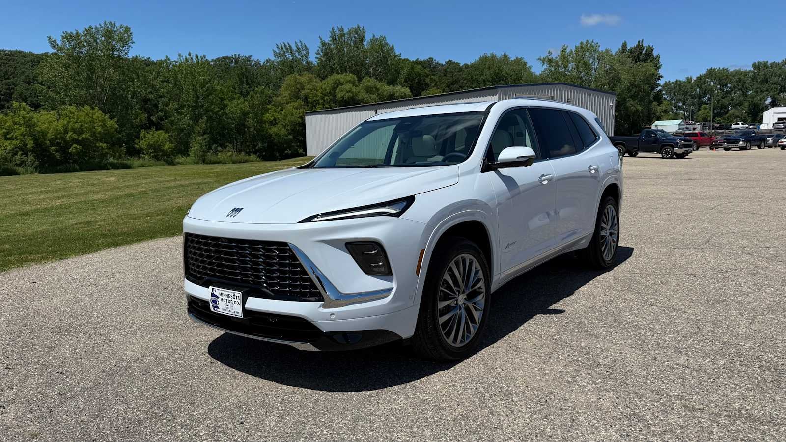 2026 Buick Enclave Avenir in Iridescent White Tricoat — front three-quarter view